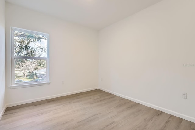 1209 S Station Pl Unit 306, Orlando, FL 32809 - spare room with light wood-style floors and baseboards