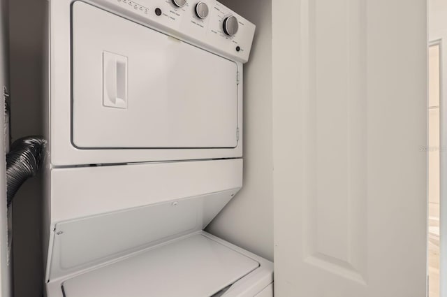 1209 S Station Pl Unit 306, Orlando, FL 32809 - laundry room with stacked washer and clothes dryer