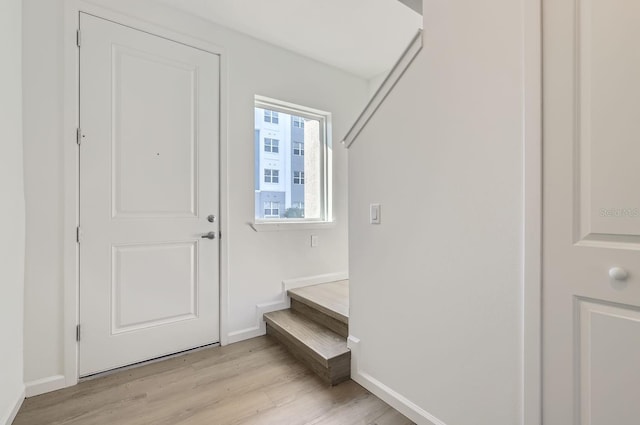 1209 S Station Pl Unit 306, Orlando, FL 32809 - mudroom with baseboards and light wood-style floors