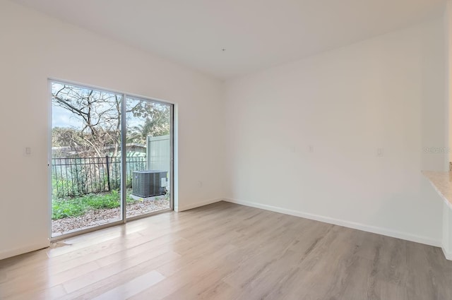 1209 S Station Pl Unit 306, Orlando, FL 32809 - empty room with light wood-type flooring and baseboards