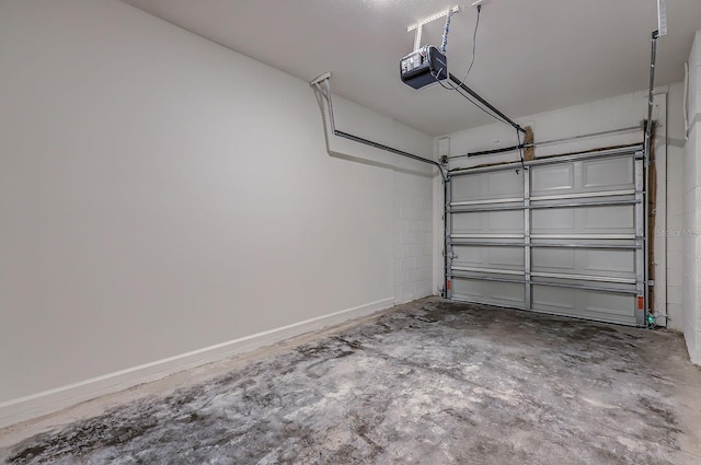 1209 S Station Pl Unit 306, Orlando, FL 32809 - garage featuring a garage door opener and baseboards