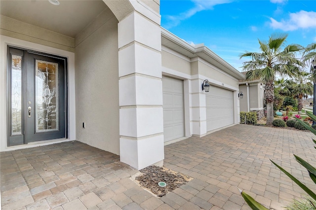 garage featuring decorative driveway