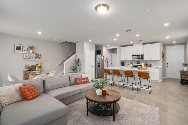 2052 Milkweed St, Ocoee, FL 34761 - living area featuring stairway and recessed lighting