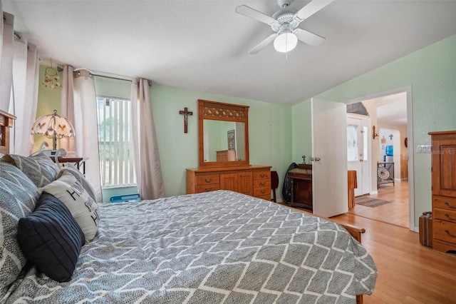 bedroom with light wood-style floors and ceiling fan