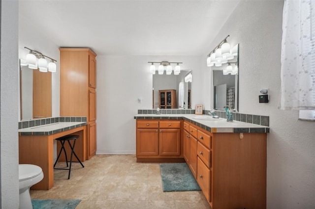 full bathroom featuring vanity and toilet