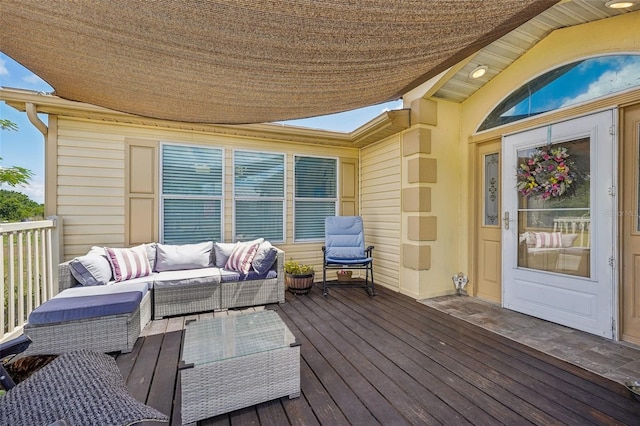 wooden terrace with an outdoor hangout area