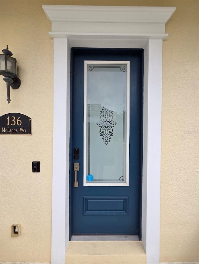 136 Mcleods Way, Winter Springs, FL 32708 - property entrance featuring stucco siding
