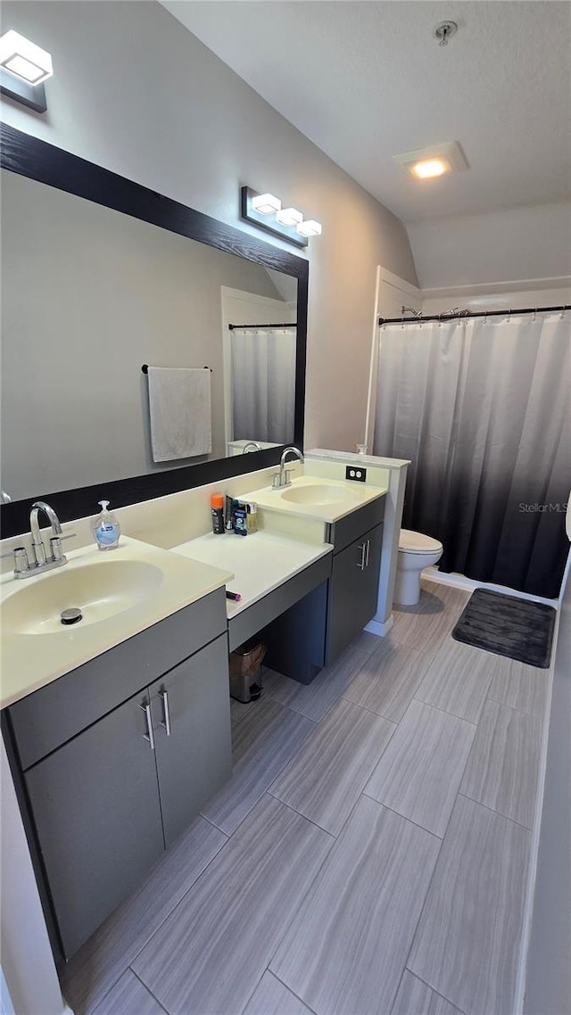 136 Mcleods Way, Winter Springs, FL 32708 - full bathroom featuring toilet, vanity, and lofted ceiling
