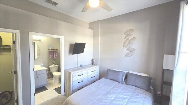 136 Mcleods Way, Winter Springs, FL 32708 - bedroom with light tile patterned floors, connected bathroom, and a ceiling fan