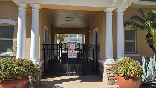 136 Mcleods Way, Winter Springs, FL 32708 - doorway to property with stucco siding and a gate