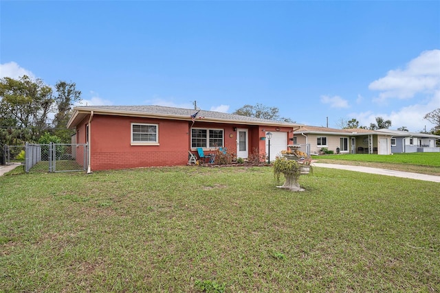 ranch-style house featuring brick siding, concrete driveway, a front yard, an attached garage, and a gate