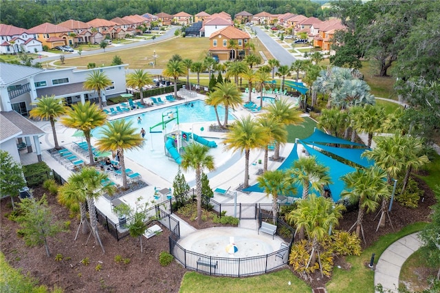 birds eye view of property with a residential view