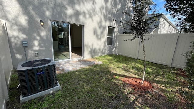 view of yard with central AC