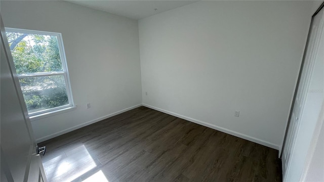 unfurnished bedroom with dark wood-type flooring