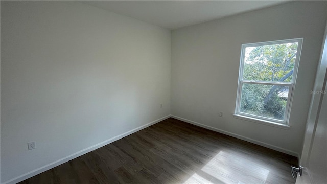 empty room featuring dark hardwood / wood-style floors