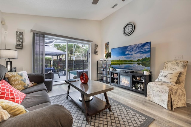 130 Bloomingdale Dr, Davenport, FL 33897 - living room with vaulted ceiling, wood finished floors, and ceiling fan