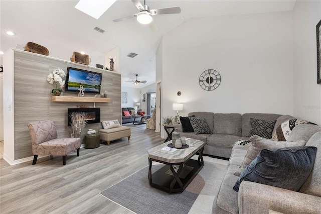 130 Bloomingdale Dr, Davenport, FL 33897 - living room with a ceiling fan, a tiled fireplace, wood finished floors, recessed lighting, and high vaulted ceiling