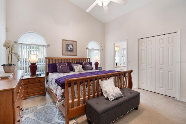 130 Bloomingdale Dr, Davenport, FL 33897 - bedroom with high vaulted ceiling, light colored carpet, a closet, and a ceiling fan