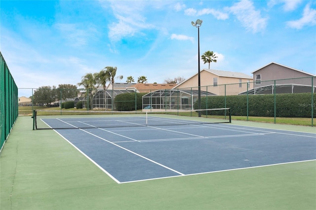 130 Bloomingdale Dr, Davenport, FL 33897 - view of tennis court with community basketball court