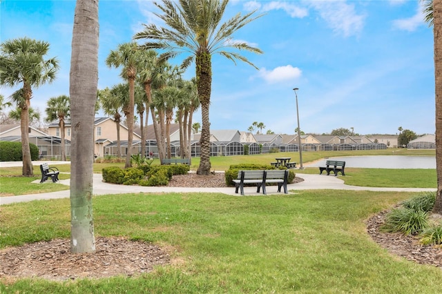 130 Bloomingdale Dr, Davenport, FL 33897 - surrounding community featuring a residential view, a lawn, and a water view