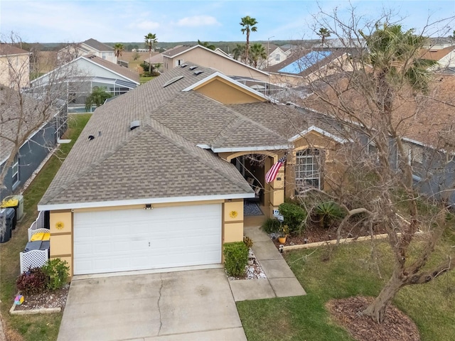 130 Bloomingdale Dr, Davenport, FL 33897 - ranch-style home featuring roof with shingles, stucco siding, concrete driveway, and a garage