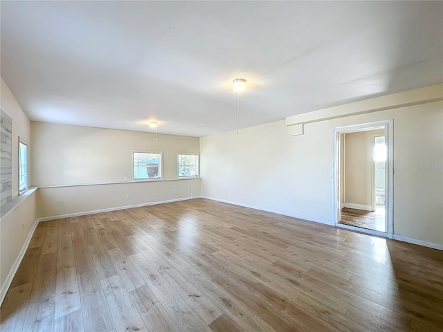 empty room with light wood-type flooring