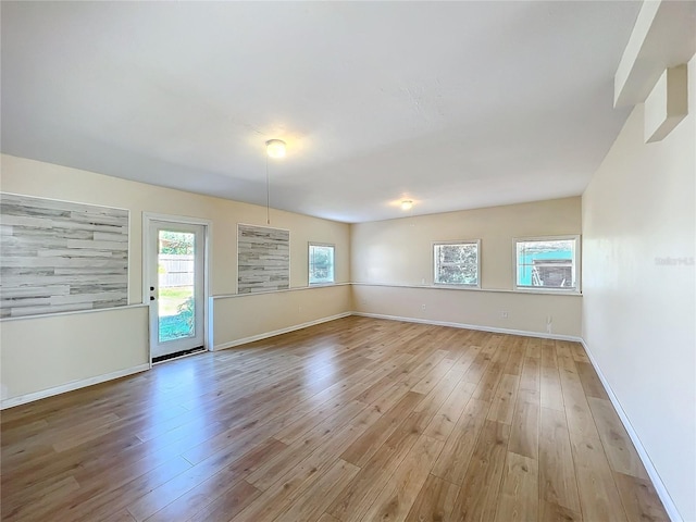 unfurnished room featuring light hardwood / wood-style floors