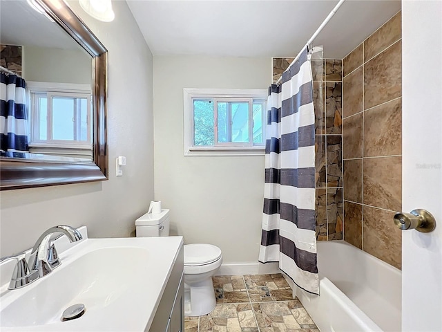 full bathroom with shower / bath combination with curtain, vanity, and toilet