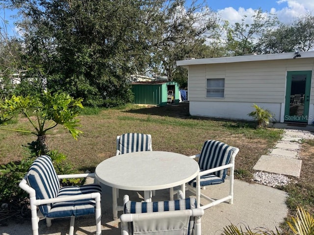 view of patio / terrace featuring a storage shed