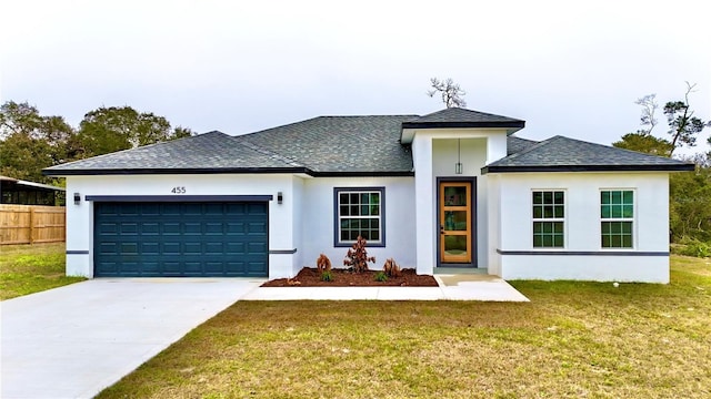 view of front facade featuring a front yard and a garage