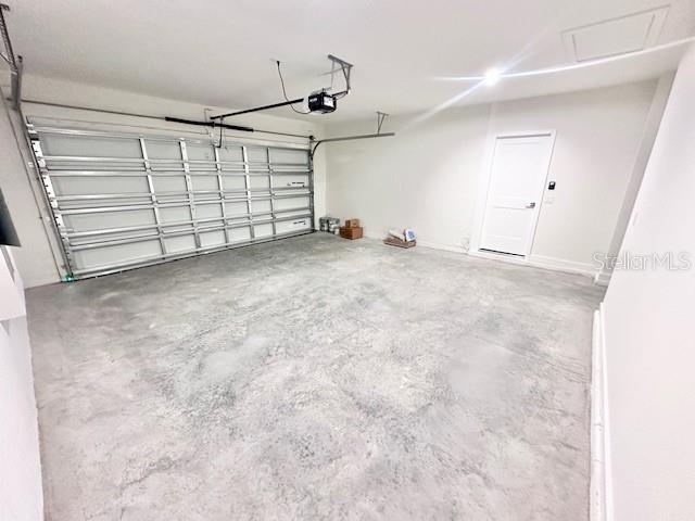 3225 Cup Dr, Lakeland, FL 33803 - garage with a garage door opener