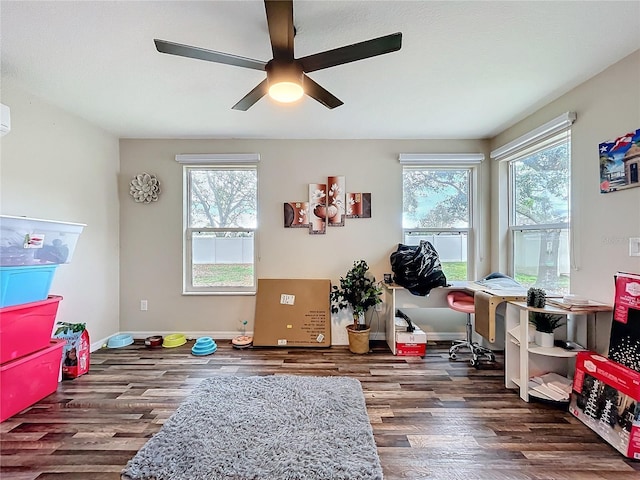 playroom featuring wood finished floors, a ceiling fan, and baseboards