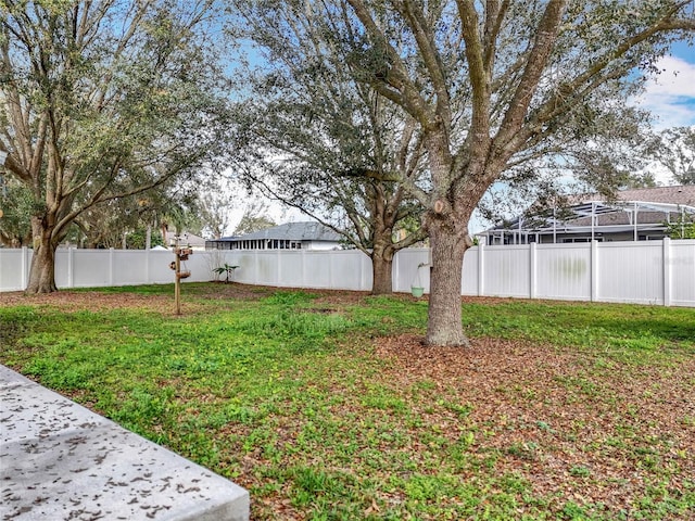 view of yard with a fenced backyard