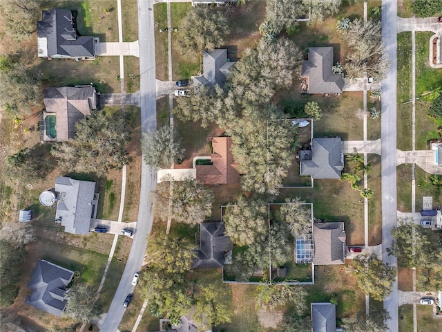 birds eye view of property with a residential view