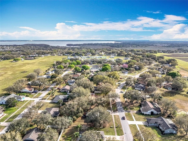 bird's eye view with a water view and a residential view