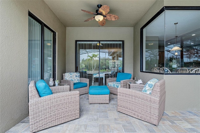 view of patio featuring an outdoor hangout area and a ceiling fan