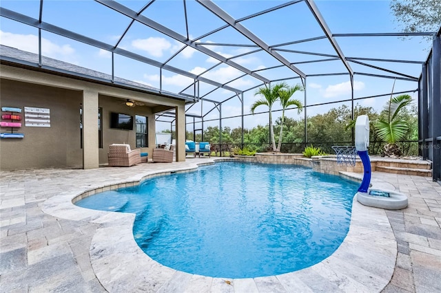 outdoor pool with a lanai, ceiling fan, an outdoor living space, and a patio