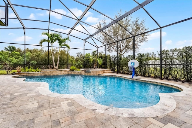 view of swimming pool with a lanai, a patio area, and a pool with connected hot tub