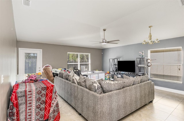 living room featuring visible vents, baseboards, and ceiling fan with notable chandelier