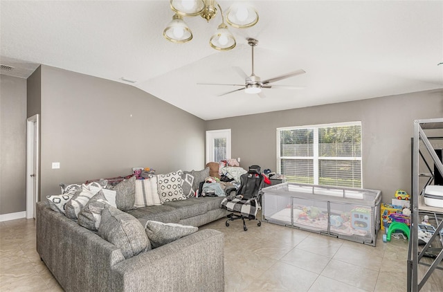 living area with light tile patterned floors, visible vents, baseboards, vaulted ceiling, and a ceiling fan