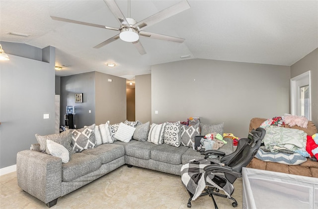 living area with baseboards, vaulted ceiling, and a ceiling fan