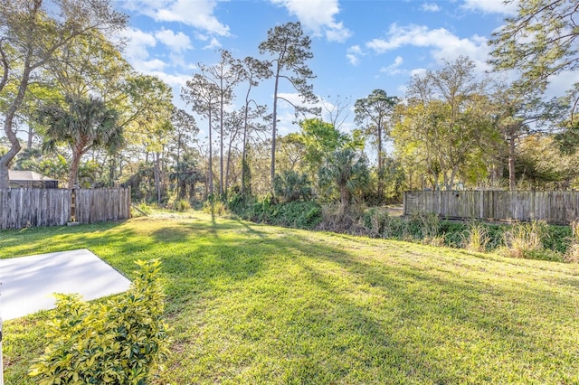 view of yard featuring fence