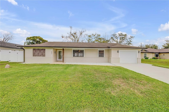 ranch-style home with driveway, a garage, a front lawn, and brick siding