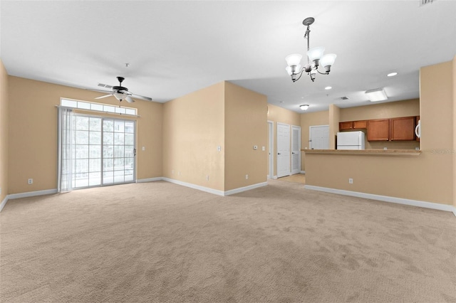 unfurnished living room featuring light carpet and ceiling fan with notable chandelier