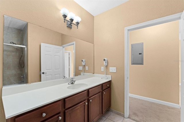 bathroom featuring tile patterned floors, vanity, and electric panel