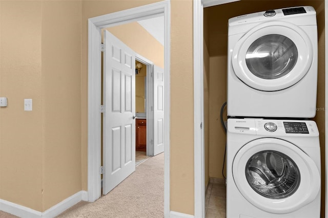 laundry room with stacked washing maching and dryer and light carpet