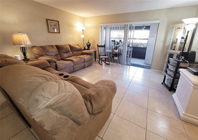 living room with light tile patterned floors and baseboards