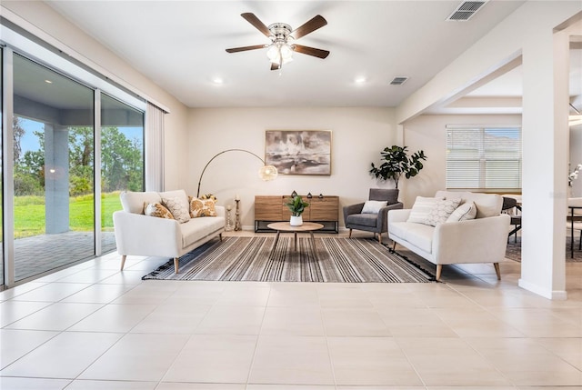 living room featuring light tile patterned floors, visible vents, a ceiling fan, and recessed lighting