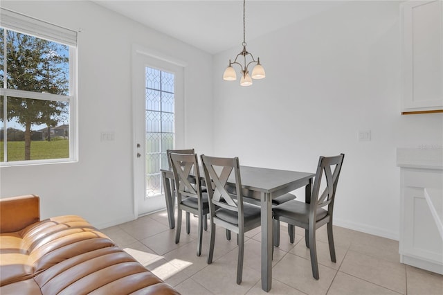 1620 Pelican Dr, Davenport, FL 33896 - tiled dining space featuring an inviting chandelier and a wealth of natural light