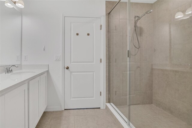 1620 Pelican Dr, Davenport, FL 33896 - bathroom with vanity, tile patterned flooring, and an enclosed shower